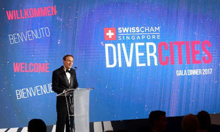 SwissCham Chairman Tom Ludescher welcomes members and guests