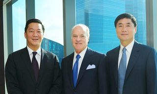 Left to right, Joseph Bae, Henry Kravis, and Ming Lu