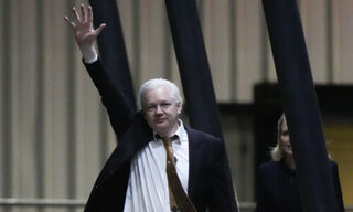 Julian Assange on his arrival in Canberra, Australia (Image: Keystone)